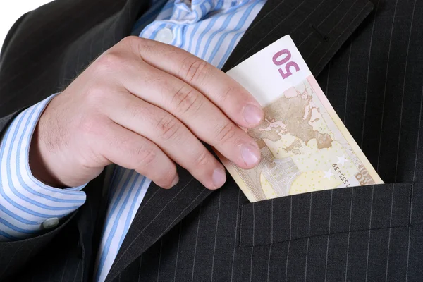 Business man hiding money in pocket. — Stock Photo, Image