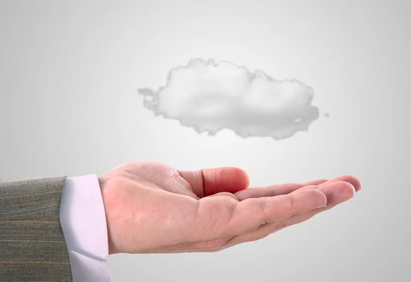 Cloud computing concept, close up of young businessman with cloud over his hand — Stock Photo, Image