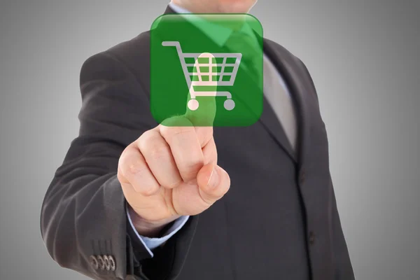 Mão empurrando símbolo virtual de compras online — Fotografia de Stock