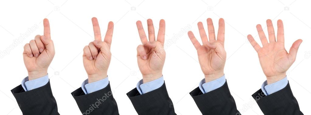 businessman's hand, counts on fingers from one to five