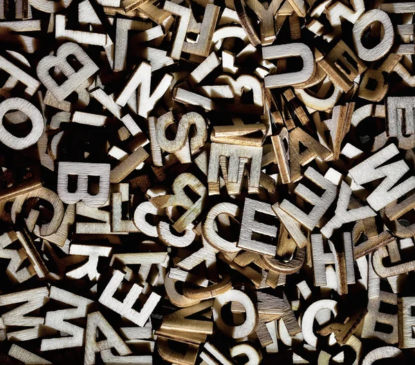 Jumbled letters made of wood close up — Stock Photo, Image