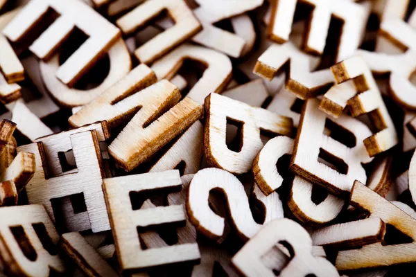 Jumbled wooden letters close up — Stock Photo, Image