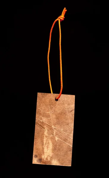 Etiqueta de papel marrom com cordão laranja — Fotografia de Stock