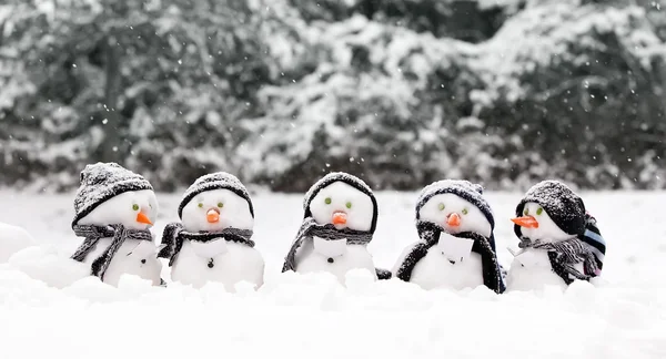 Little snowmen in a group Stock Photo