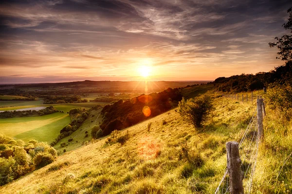 Hill fence sunset — Stock Photo, Image