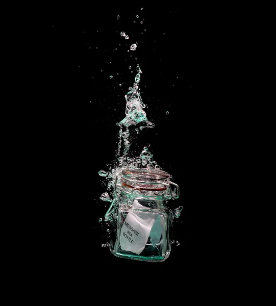 Message in sinking bottle — Stock Photo, Image