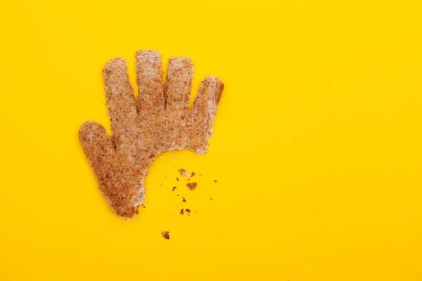 Bite Hand Feeds Concept Made Toasted Bread Cutout Hand Shape — Stock fotografie