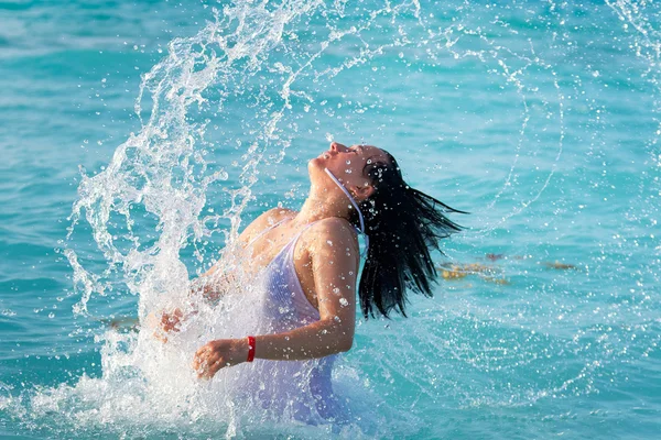 Jumping out of the Caribbean Sea — Stock Photo, Image