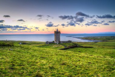 Doonagore castle at sunset clipart