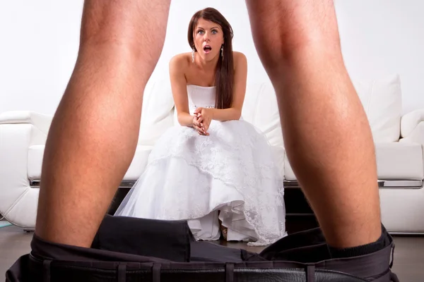 Bride shocked at the groom striptease — Stock Photo, Image