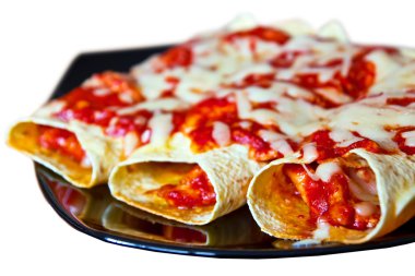 Mexican enchiladas on plate clipart