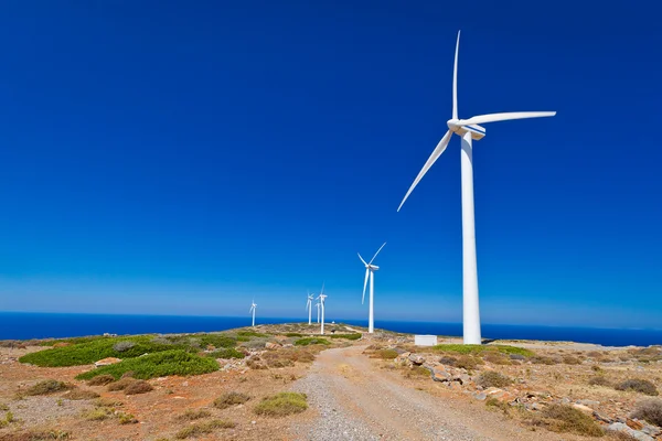 Wind turbines field over blue sky on Crete — Stock Photo, Image