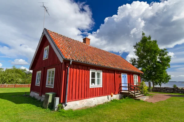 Červené švédské chalupě — Stock fotografie