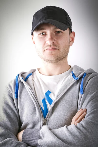 Portrait of young man in sport hat — Stock Photo, Image