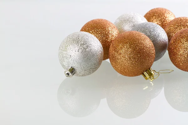 Christmas baubles reflected on glass — Stock Photo, Image