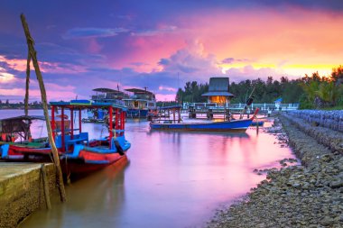 Amazing sunset at the harbor in Thailand clipart