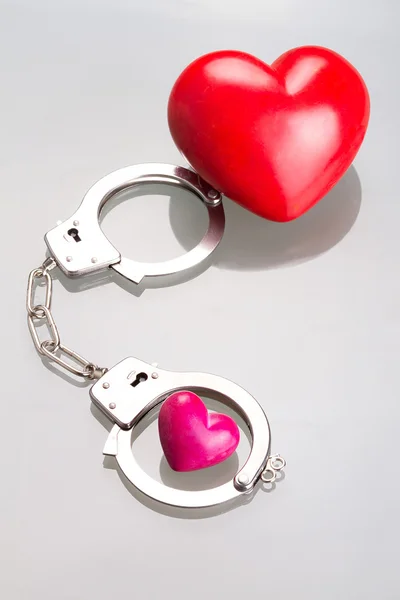 Heart shapes in handcuffs — Stock Photo, Image