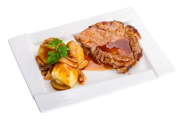 Geroosterd varkensvlees met jus en aardappelen — Stockfoto