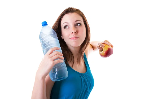 Young woman with bottle of water and apple — Stock Photo, Image