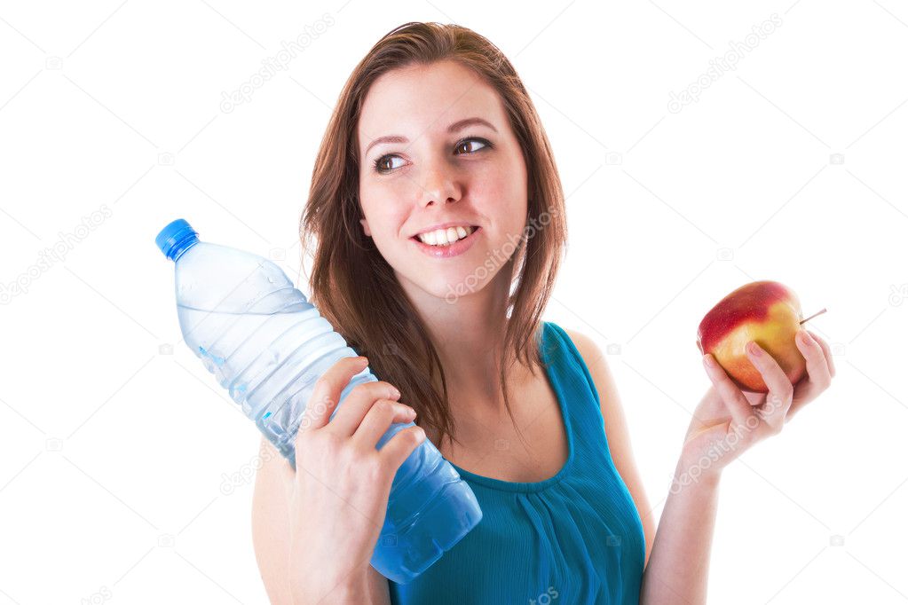 Young woman with bottle of water and apple