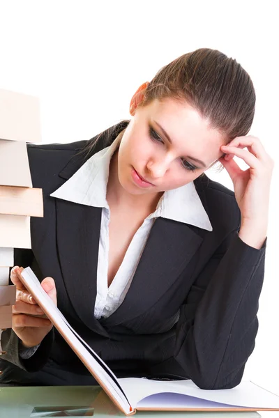 Young brunette hardly studying from the book — Stock Photo, Image