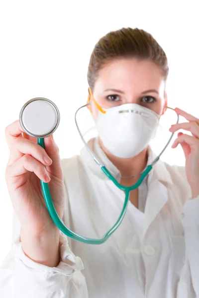 Female doctor in mask with pointed stethoscope — Stock Photo, Image