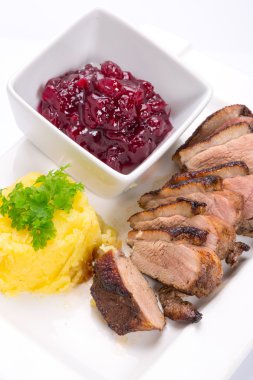 Roasted duck breast with potatoes clipart