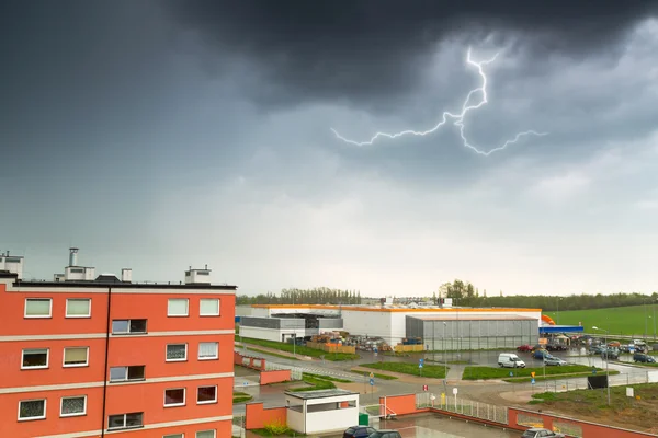 Summer thunderstorm over city buildings — Stock Photo, Image