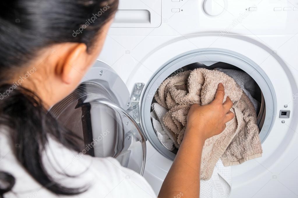 Woman loading laundry