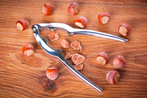 Hazelnuts with nutcracker — Stock Photo, Image