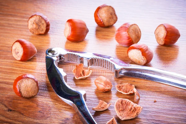 Hazelnuts with nutcracker — Stock Photo, Image