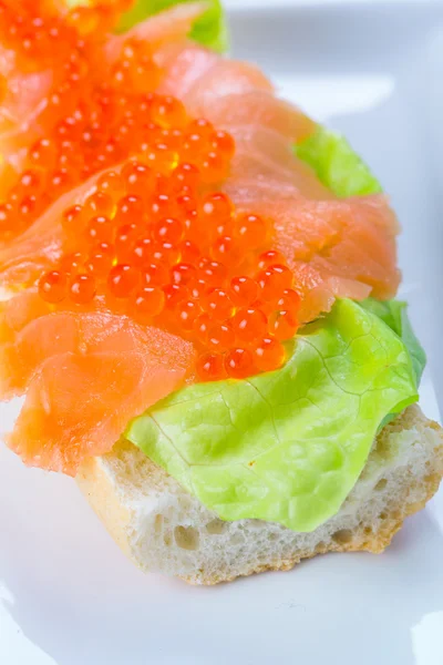 Caviar and smoked salmon sandwich — Stock Photo, Image