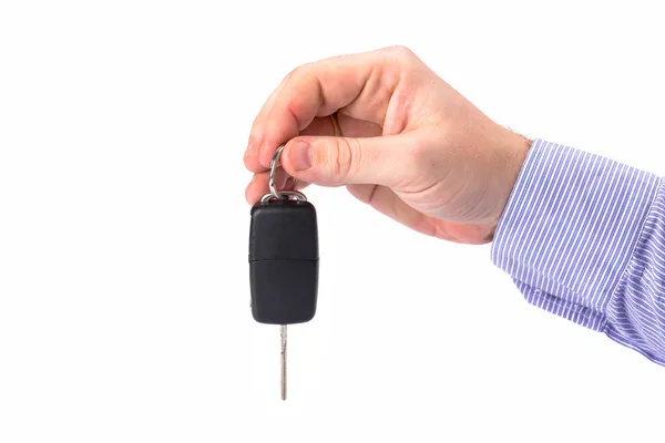 Hand with car key over white — Stock Photo, Image