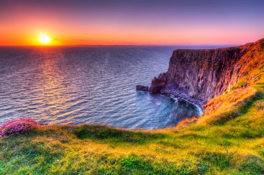 Cliffs of Moher at sunset clipart