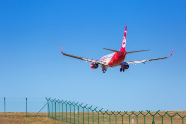 Air Berlin plane landing on the airport in Gdansk clipart