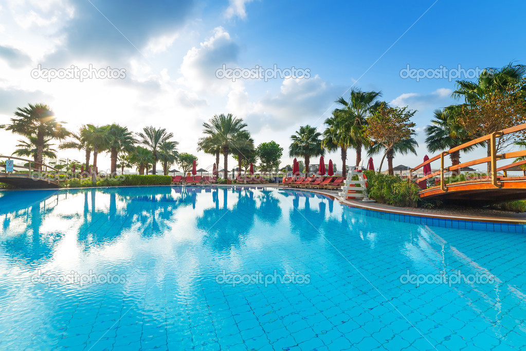 Sunrise at the tropical swimming pool