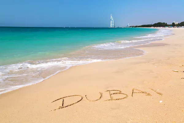 Dubai sign on the beach — Stock Photo, Image