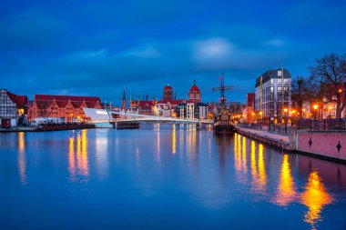 Beautiful architecture of Gdansk old town reflected in the Motlawa river at dawn, Poland