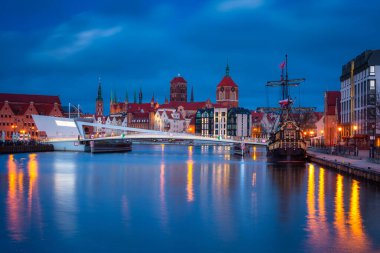 Beautiful architecture of Gdansk old town reflected in the Motlawa river at dawn, Poland