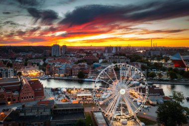 Ferris wheel in Gdansk by the Motlawa River at sunset, Poland clipart
