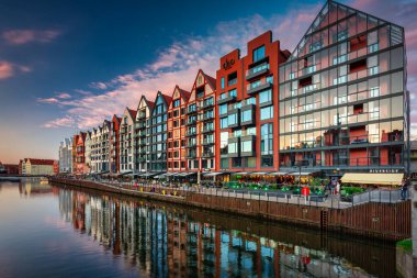 Gdansk, Poland - July 4, 2022: Beautiful architecture of the Main Town of Gdansk over the Motlawa River at sunset, Poland.