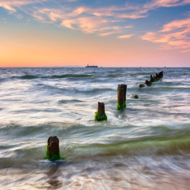 Sunset on the beach of the Baltic Sea in Gdansk, Poland