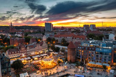 Gdansk, Poland - July 4, 2022: Beautiful architecture of the Main Town of Gdansk over the Motlawa River at sunset, Poland.