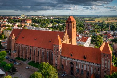 The castle and cathedral in Kwidzyn illuminated by the setting sun, Poland