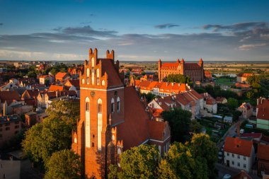 Teutonic castle and the church in Gniew in the light of the setting sun. Poland