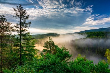 Panorama of the Karkonosze Mountains in Poland at dawn.