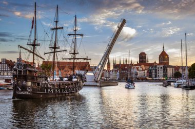 Gdansk, Poland - July 29, 2022: Pirate sailing ship with tourists on board in the waters of the Motlawa river in Gdansk, Poland.