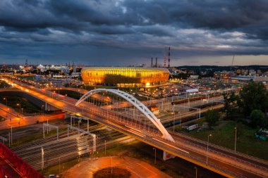 Gdansk, Poland - August 31, 2022: Aerial landscape with amber shape Stadium by the Baltic Sea in Gdansk at dusk, Poland.