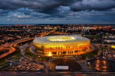 Gdansk, Poland - August 31, 2022: Aerial landscape with amber shape Stadium by the Baltic Sea in Gdansk at dusk, Poland.