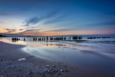 Sunset on the beach of the Baltic Sea in Gdansk, Poland